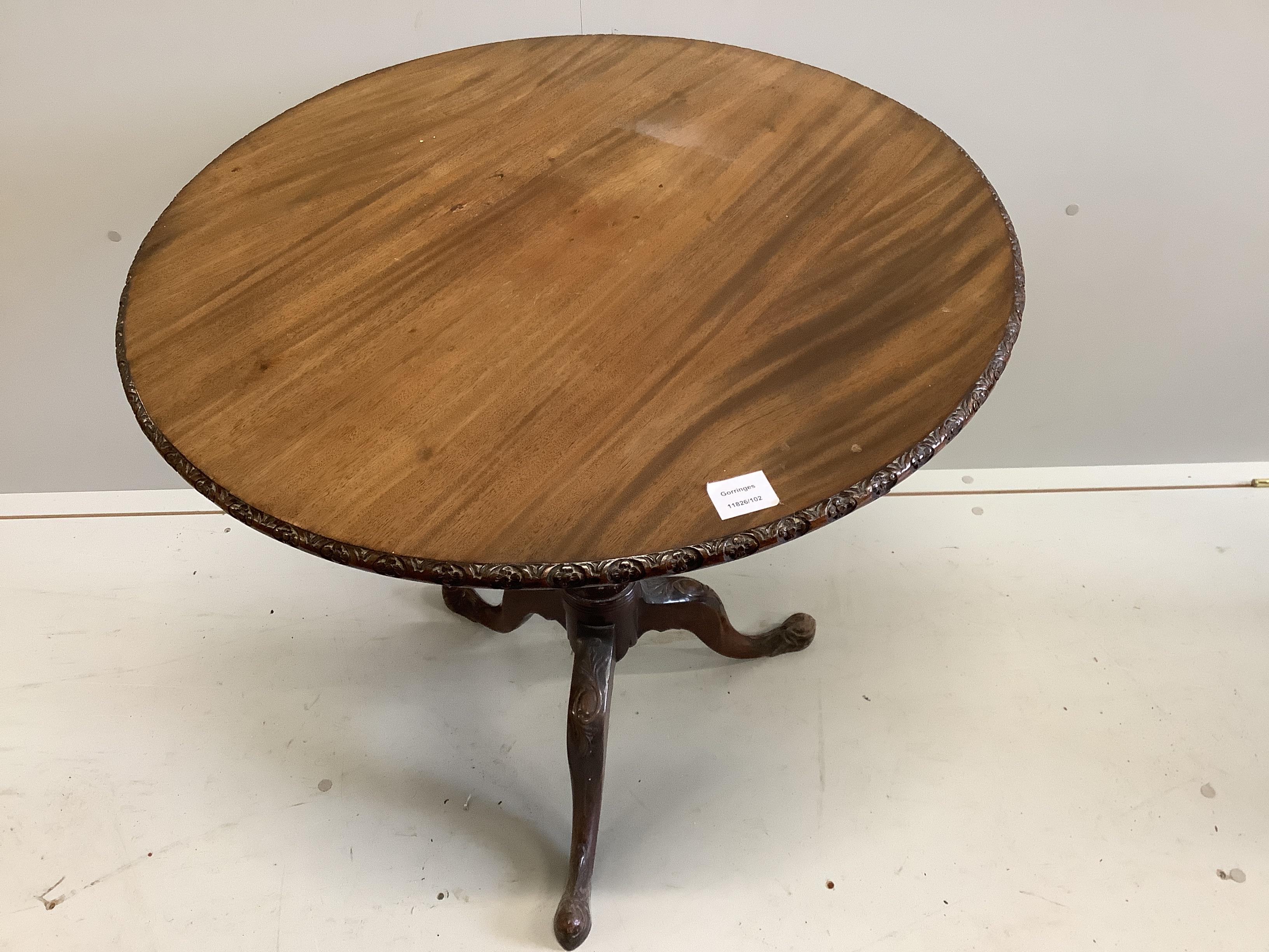 A George III style circular mahogany tilt top tripod tea table, diameter 76cm, height 72cm